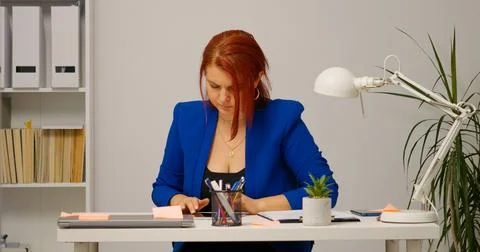 Female working from home using a tablet. Stock Photos