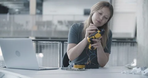 Female working on robotics Stock Footage 116478324