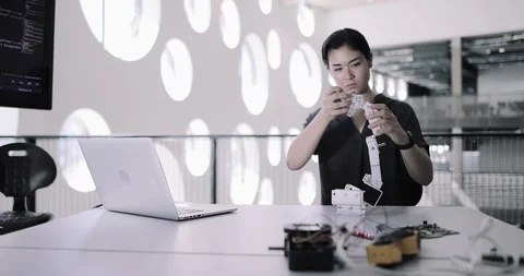 Female working on robotics Stock Footage 116496647