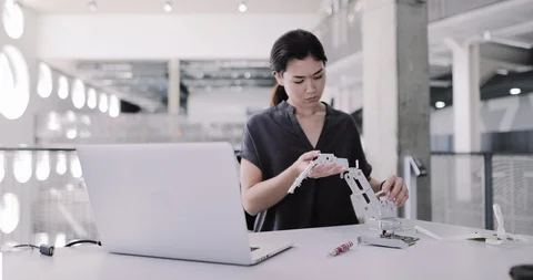 Female working on robotics Stock Footage 116497438