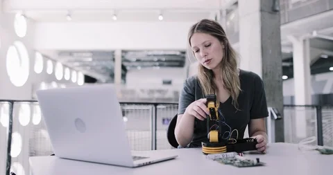 Female working on robotics Stock Footage 116498245