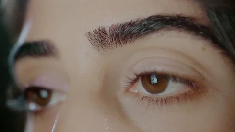 Female is Working on Smart Device with Reflection at Eyeballs Stock Footage 98343102