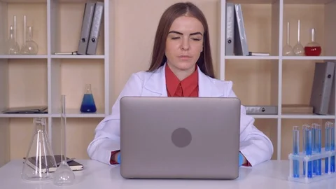 Female works with liquid in lab Stock Footage 86419985