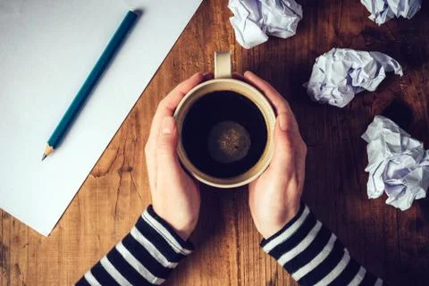 Female writer drinking cup of coffee Stock Photos