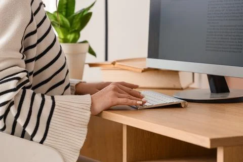 Female writer editing text on computer before publishing in office, closeup Stock Photos