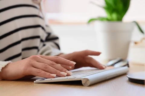 Female writer editing text on computer before publishing in office, closeup Stock Photos
