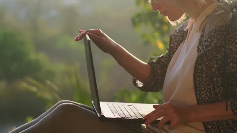 Female writer finished her work at sunrise. Stock Footage 242553448