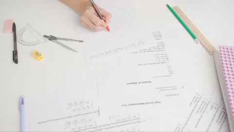 Female writes correct answer in geometry exam test paper with pen. Student Stock Footage 280167826