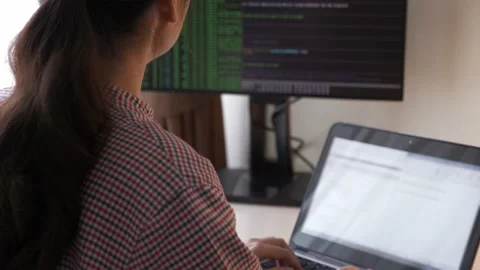 Female young Asian program engineer working with computer, coding,analysing data Video stock 146840375