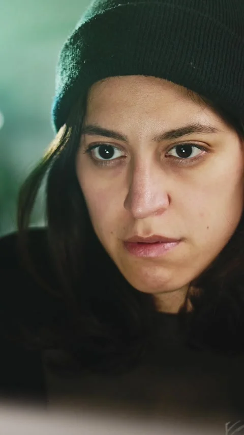 Female young hacker working on computer in dark room programming code Stock Footage 316850091