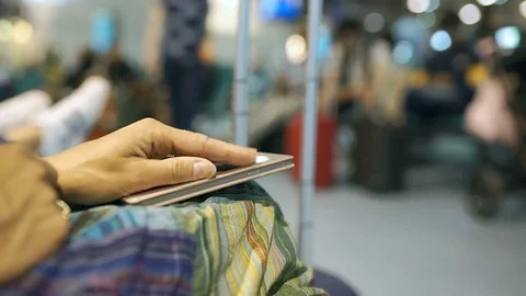 Female's fingers tapping on smartphone because of irritation, steadycam shot Stock Footage