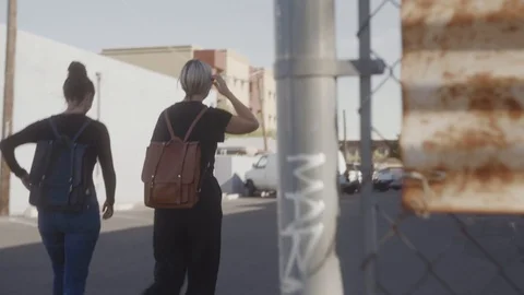 Females walking outside side by side Stock Footage 111593521