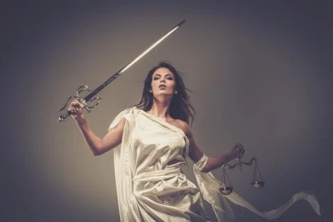 Femida, goddess of justice, with scales and sword Stock Photos
