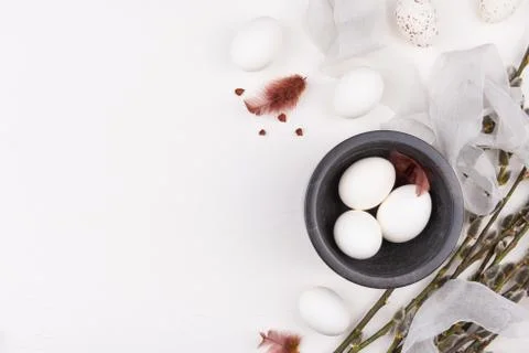 Feminine Easter concept. Stylish background with white eggs in black bowl Stock Photos