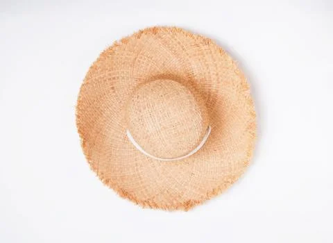 Feminine straw hat with big fields isolated on thite background Stock Photos