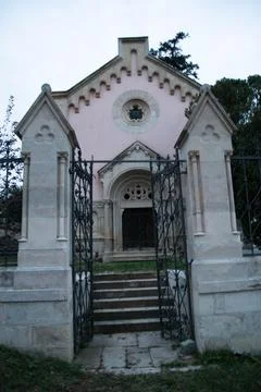 The fence and the crypt. Stock Photos
