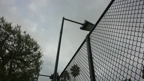Fence and light at a park Stock Footage 304089365