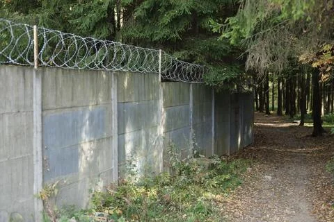 Fence around the land plot. Fenced area. 写真素材