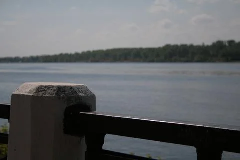 Fence on the background of the river Stock Photos