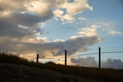 Fence of barbed wire on the border with Mongolia. Ukok Plateau Of Altai. Fabu Stock Photos
