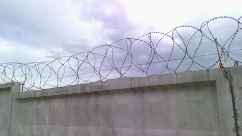Fence With Barbed Wire Stock Footage 155215450