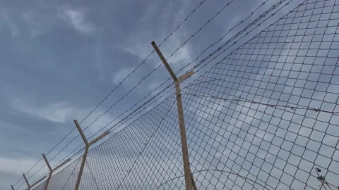 Fence With Barbed Wire Stock Footage 169816746