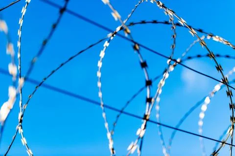Fence with barbed wire Stock Photos
