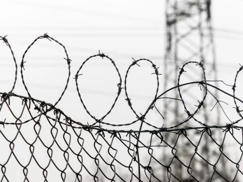Fence with barbed wire Stock Photos