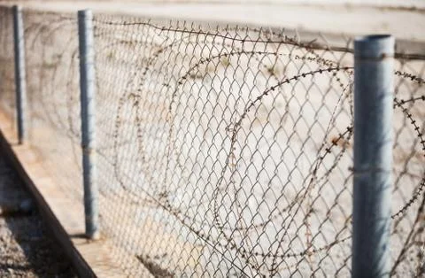 Fence with barbed wire Stock Photos