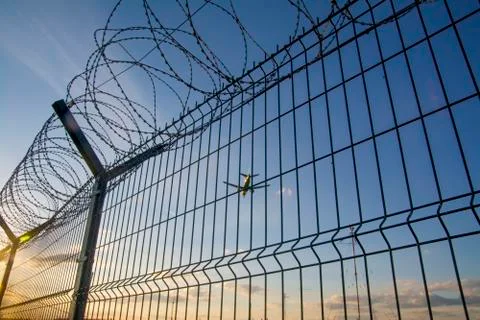 Fence with barbed wire. Stock Photos