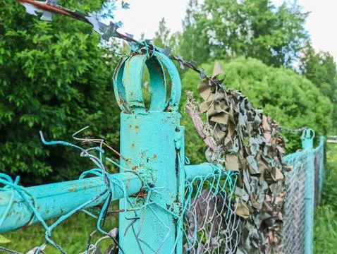 Fence With A Barbed Wire Stock Photos