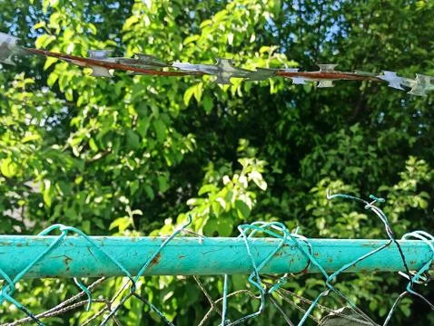 Fence With A Barbed Wire Stock Photos