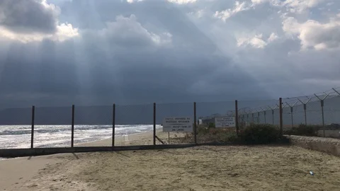 Fence at the beach against cloudy Sky with Sunlights Stock-Footage 98149438