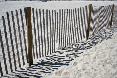 Fence on the beach Stock Photos