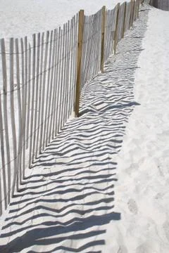 Fence on a beach Stock Photos