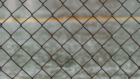 Fence with blurred rain are dropping on road, Chiangmai province Thailand. Stock Footage 240993373