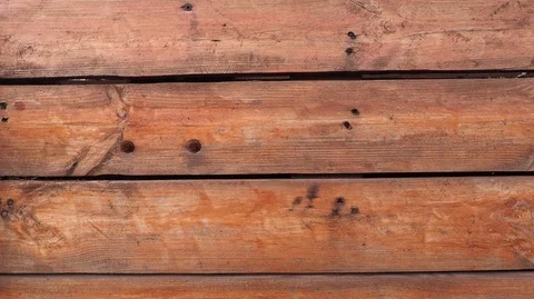 Fence boards of pine arranged horizontally and painted in orange Stock Footage 124745708