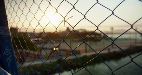 Fence of a Bridge in the Sunset at the Beach Stock Footage 247460640