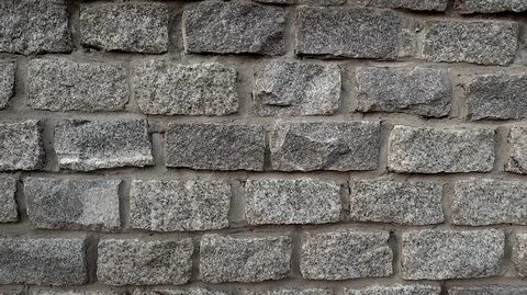 Fence of clipped stones of rectangular gray color with flat masonry Stock Footage 124746606