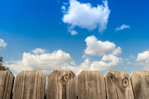 Fence with clouds Stock Photos