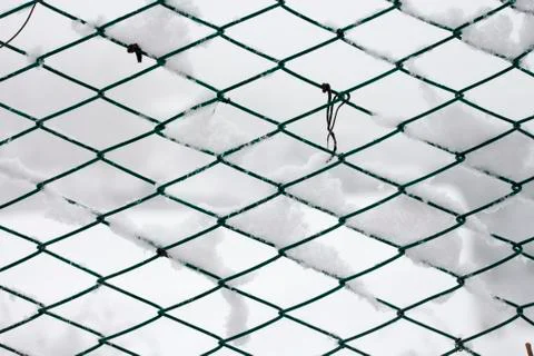 Fence covered by snow - background Stock Photos