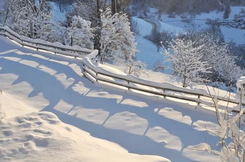 Fence crossing snow Stock-Fotos