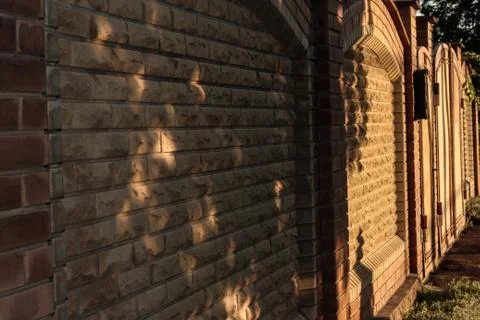 The fence of the decorative stone. Side view. Stock Photos