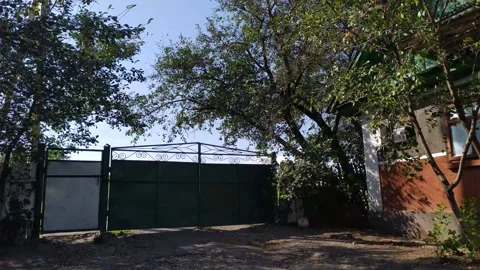 A fence in front of a tree Stock Footage 130504964