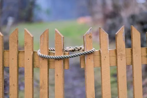Fence gate with a rope Stock Photos