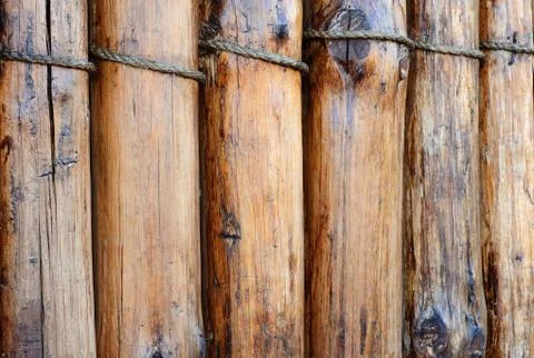 A fence made of logs. Stock Photos