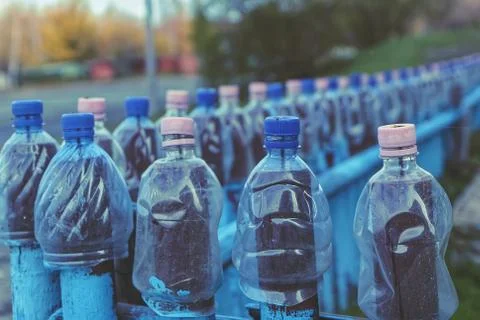 The fence is made of plastic bottles Stock Photos