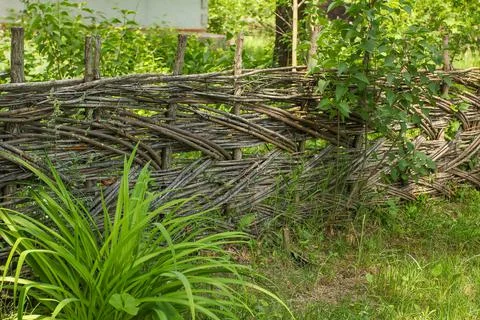 Fence made of tree branches boards Stock Photos