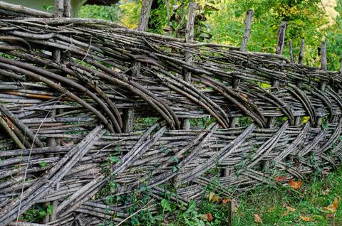 Fence made of tree branches boards Stock Photos
