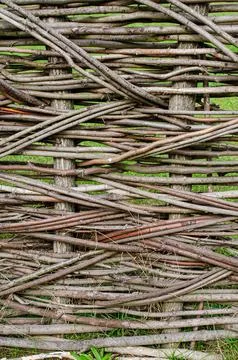 Fence made of tree branches boards Stock Photos